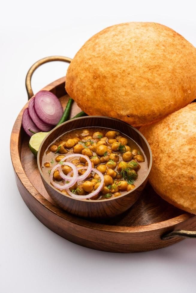 Download Chole bhature is a North Indian food dish_ A combination of chana masala and bhatura or puri for free Chole bhature - Image 1